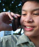 Photo of boy talking on cell phone